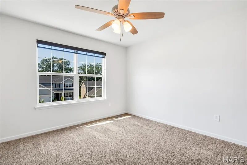 Bedroom 2 with double window, tons of natural lighting and ceiling fan. — 425 Dusty Brook Drive, O'Fallon, MO 63366