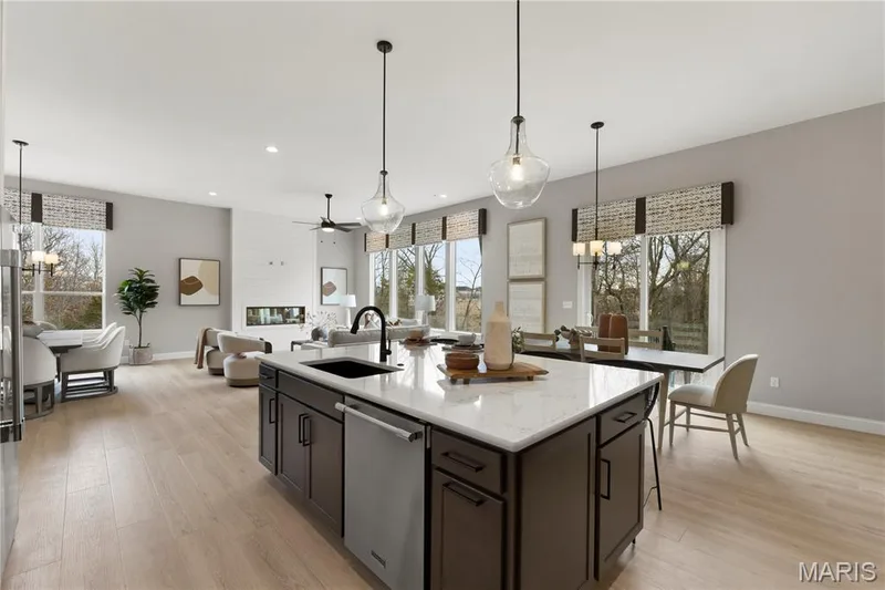 Kitchen with custom Two Tone Cabinets, Stainless Steel Gas appliances and Quartz Countertops — 14 Cedarstone Court, Dardenne Prairie, MO 63368