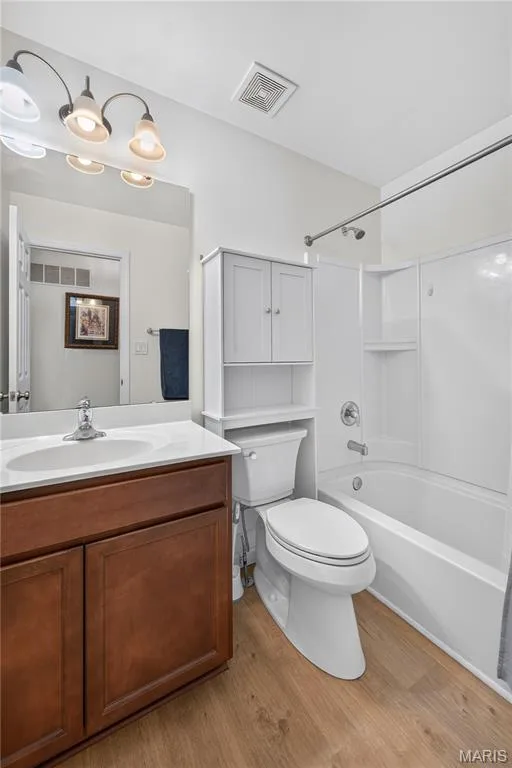 Main Floor Full Bath with Luxury Vinyl Wood Wide-Plank Floors, Tall Vanity, Elongated Toilet & Shelving! — 156 Hidden Bluffs Drive, Lake St. Louis, MO 63367