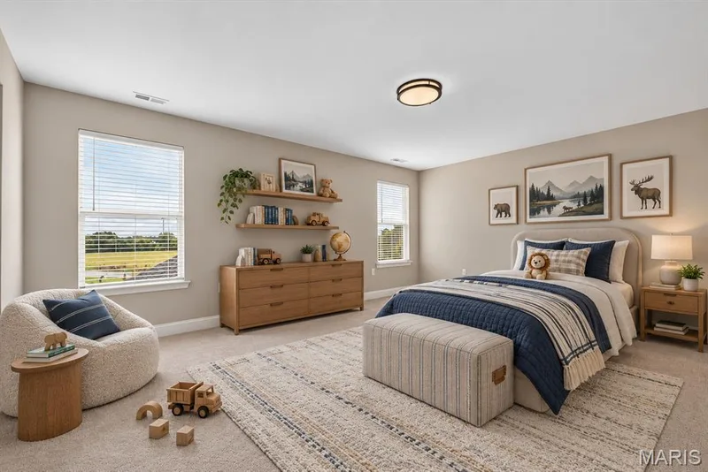 Recessed windows with blinds, wood-finish shelving, and a flush-mount ceiling light. Also features a walk-in closet and Jack and jill bathroom — 26 Valor Way, O'Fallon, MO 63385