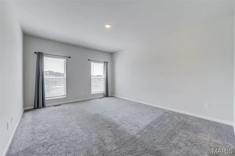Primary bedroom with luxury bath and large walk-in closet — 118 Riding Crop Lane, Wentzville, MO 63385