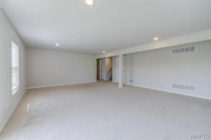 Partially finished basement with rec room, framed out for a 4th bedroom and bathroom rough in — 118 Riding Crop Lane, Wentzville, MO 63385