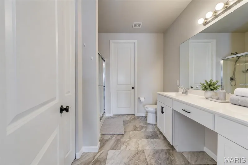 Primary bath with Walk-in shower, adult height duo vanilty and large linen closet — 118 Riding Crop Lane, Wentzville, MO 63385