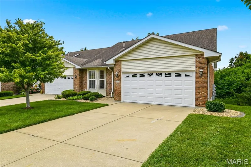 Brick and siding facade with attached two-car garage — 3515 Truman Terrace Drive #65, St Charles, MO 63301