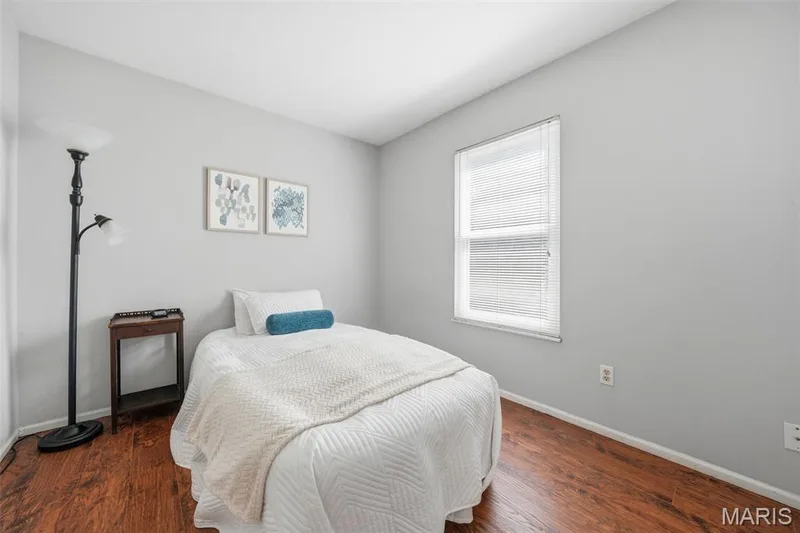 Bright room featuring wood-finish flooring and light gray walls — 2510 Balaji Court, Wildwood, MO 63011