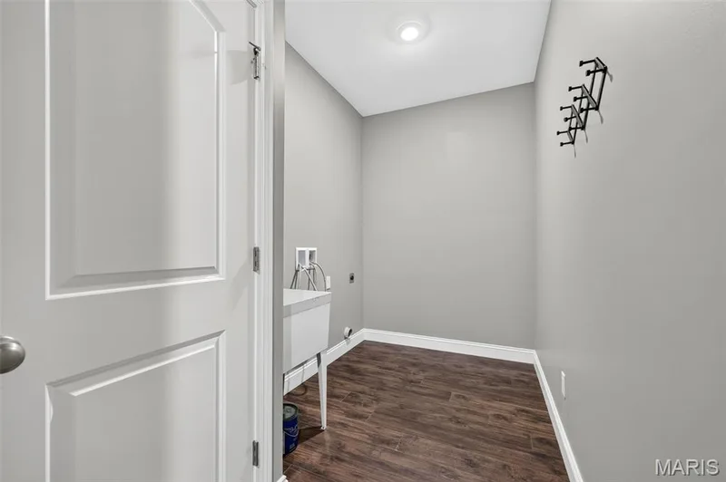 Wood-finish flooring, recessed lighting, and a utility sink — 401 Hamlet Court, O'Fallon, MO 63367
