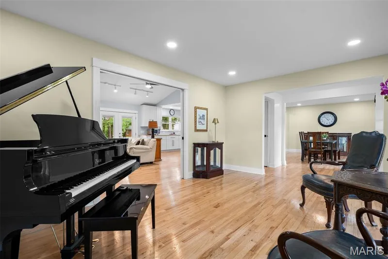 Living room features hardwood floors and new recessed lighting throughout the home. — 312 Diplomat Lane, Chesterfield, MO 63017