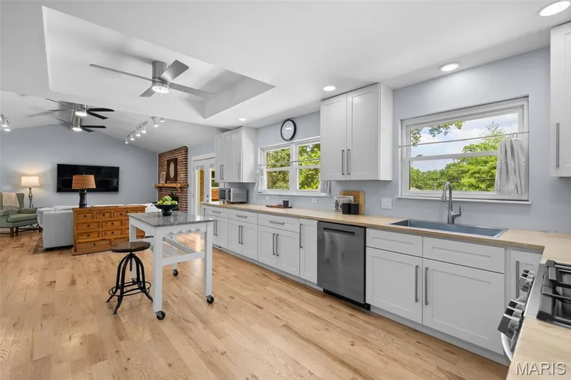 Tray ceilings in kitchen, primary and 2nd bedroom adding height and light to each room — 312 Diplomat Lane, Chesterfield, MO 63017