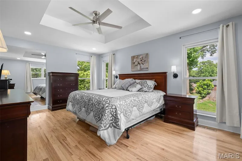 Primary en-suite with tray ceilings a new ceiling fan and added windows — 312 Diplomat Lane, Chesterfield, MO 63017
