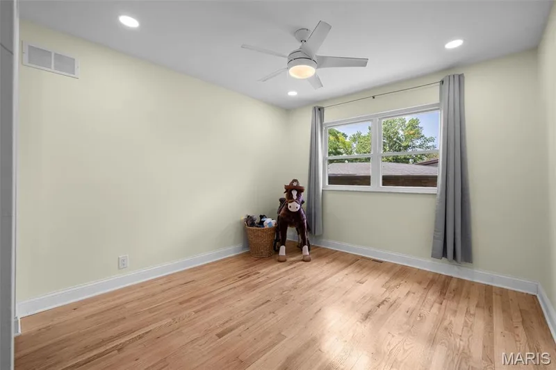 2nd bedroom with refinished hardwood floors, recessed lighting and new ceiling fan — 312 Diplomat Lane, Chesterfield, MO 63017