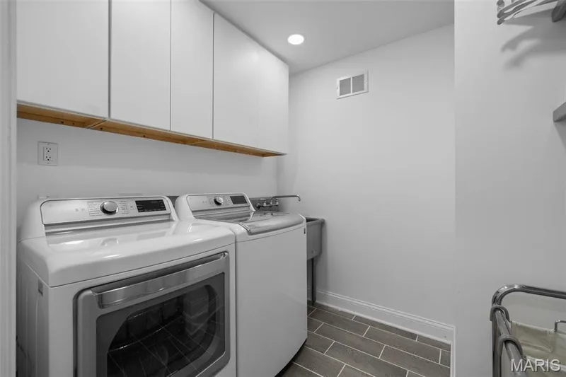 Main floor laundry!!!Stainless steal shelving and a utility sink for added convenience. — 312 Diplomat Lane, Chesterfield, MO 63017
