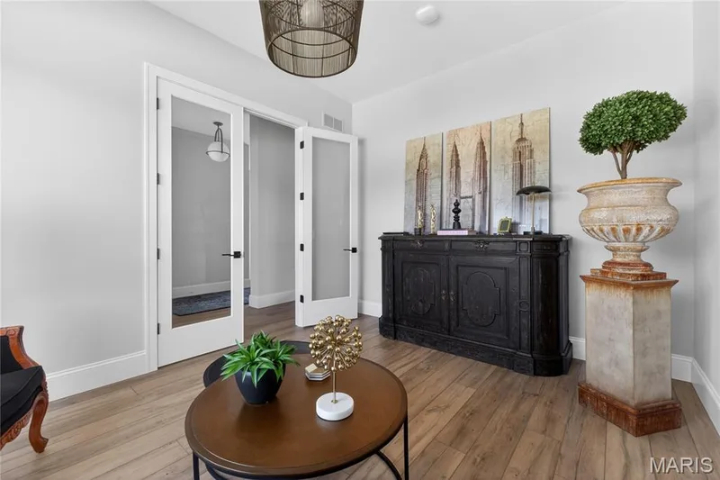 Den has French doors and mirrored alcove before you enter the space. — 16529 Waterfront Avenue, Chesterfield, MO 63017