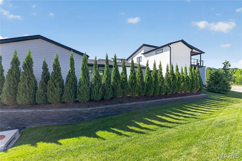 Landscape wall, fencing, and extra landscaping to secure privacy in the poo area. — 16529 Waterfront Avenue, Chesterfield, MO 63017