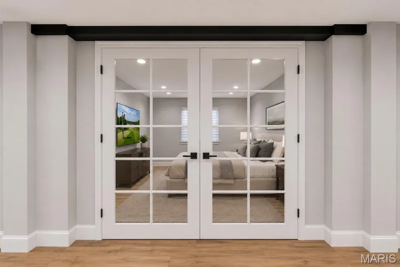 AI Rendering. Possibilities to install French doors in Lower Level with existing window could be another bedroom. — 16529 Waterfront Avenue, Chesterfield, MO 63017
