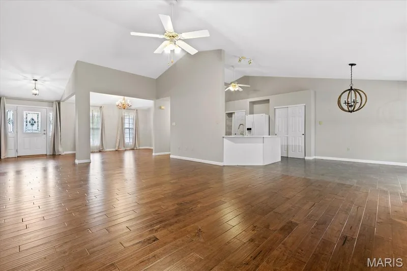 View from living room looking into the kitchen and dining room — 8010 Knights Crossing Drive, O'Fallon, MO 63368