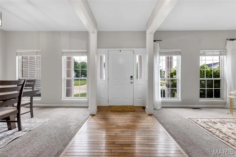 Bright Entry Foyer with Dining to the left and sitting room to the right — 501 Oxborough Court, Cottleville, MO 63376