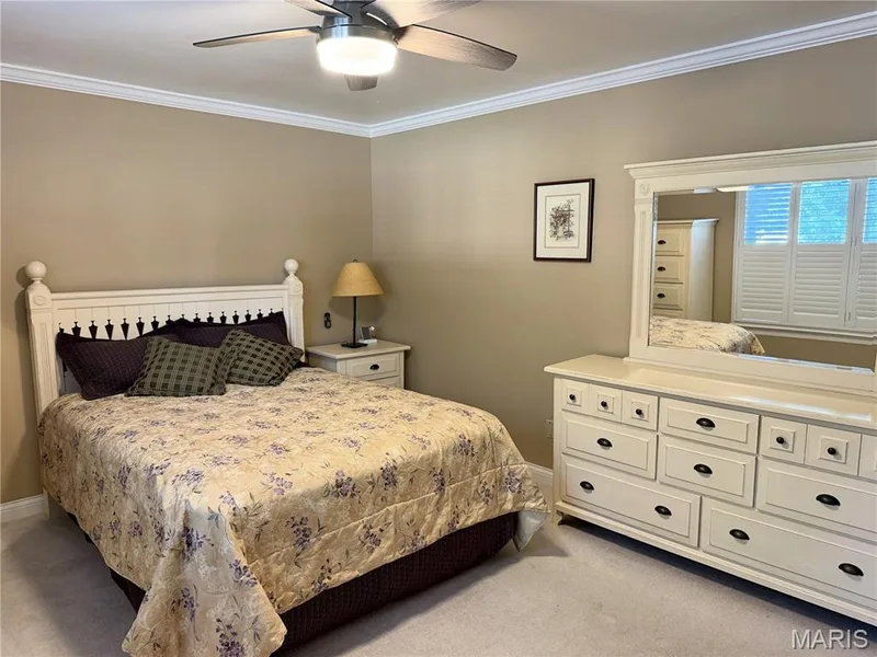 Crown molding, ceiling fan with integrated lighting, and carpeted flooring — 14238 Kinderhook Drive, Chesterfield, MO 63017