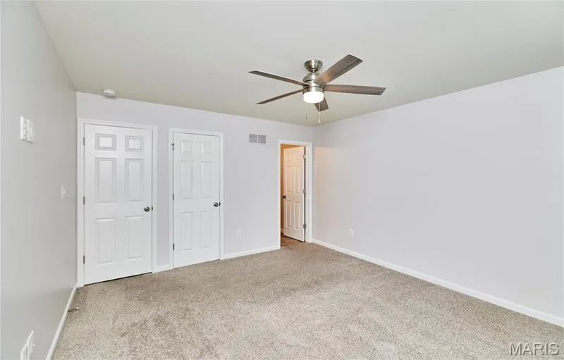 Another view of the Primary bedroom with walk-in closet and full bath. — 133 Day Lily Lane, Wentzville, MO 63385