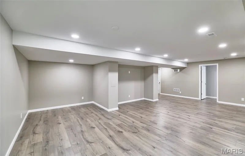 Gorgeous LL finished Family Room area with custom LVP floors and recessed lighting. Plus freshly painted throughout! — 133 Day Lily Lane, Wentzville, MO 63385