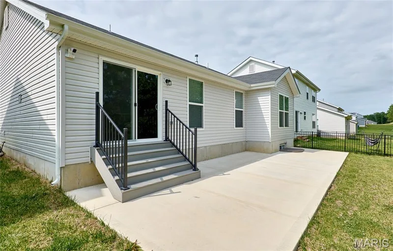 Another WOW! Custom staircase to the huge, extended and newer patio area. — 133 Day Lily Lane, Wentzville, MO 63385