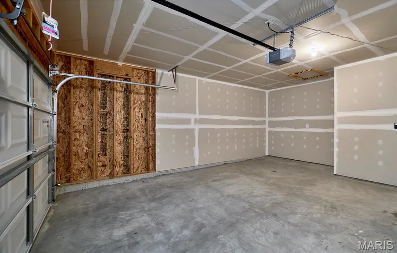 The oversize 2 car garage features an extended area perfect for storage or add'l room for toys/vehicle. — 133 Day Lily Lane, Wentzville, MO 63385