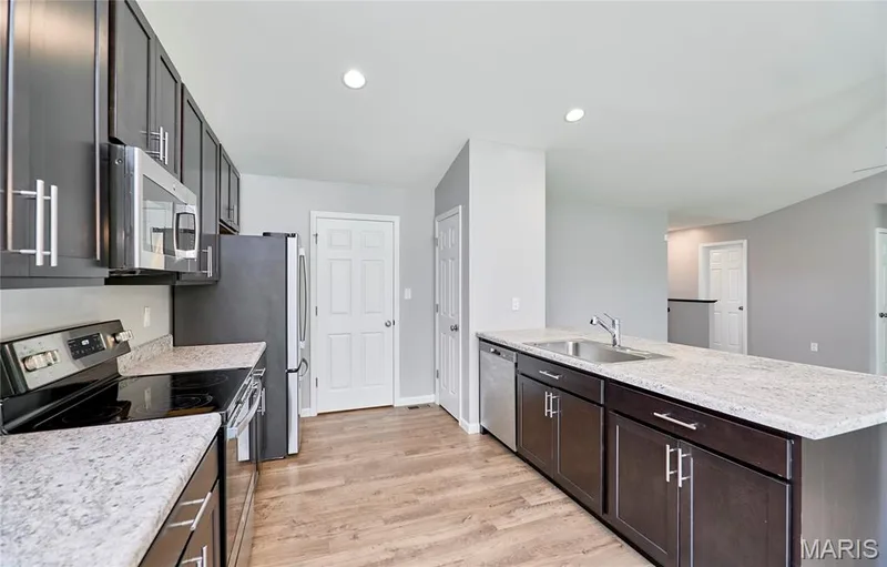 Another view looking to the main floor laundry area and to the oversize 2 car garage. — 133 Day Lily Lane, Wentzville, MO 63385