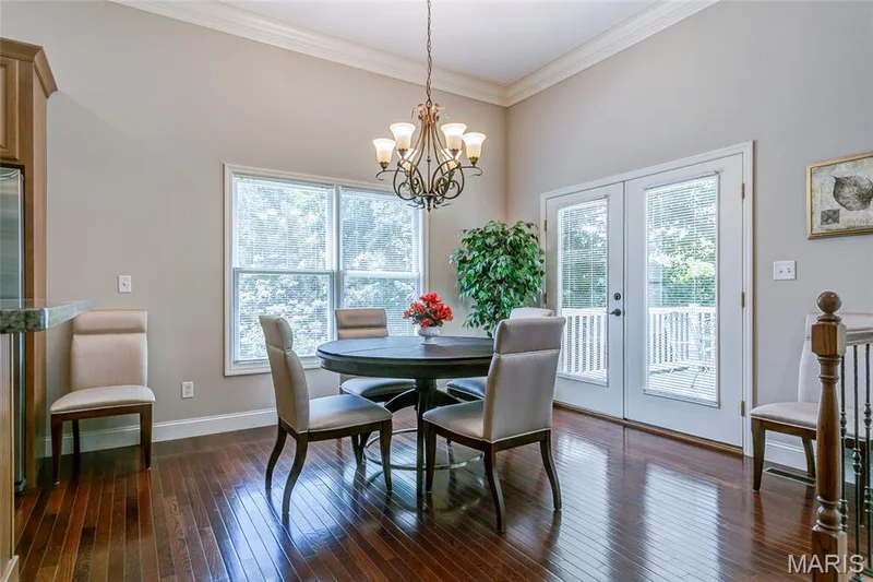 Guest sized breakfast area with more elegant hardwood flooring. — 1209 Silver Fern Drive, Lake St. Louis, MO 63367