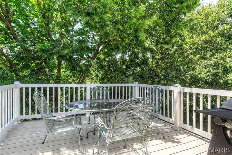 One of two low maintenance decks overlooking trees.  Upper deck — 1209 Silver Fern Drive, Lake St. Louis, MO 63367