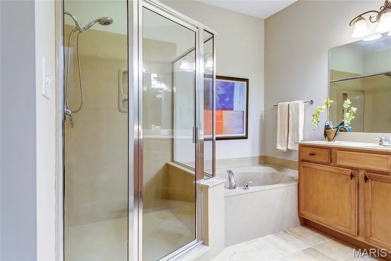 Delightful master bath with double bowl vanity and soaking tub. — 1209 Silver Fern Drive, Lake St. Louis, MO 63367