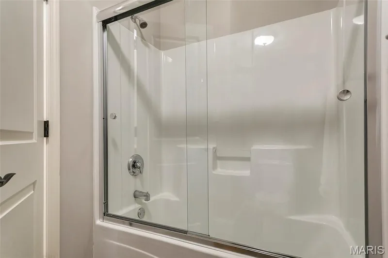 Enclosed tub/shower in lower bath. — 1209 Silver Fern Drive, Lake St. Louis, MO 63367
