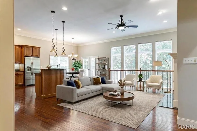 Dramatic open kitchen/great room showing off nature as an atrium wall of windows was meant for! — 1209 Silver Fern Drive, Lake St. Louis, MO 63367