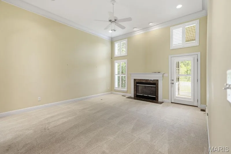 Large family room with gas fireplace, 12ft ceilings, natural light — 14 Burgundy Place Drive, Dardenne Prairie, MO 63368