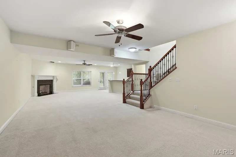 Large, finished living/game room in lower-level w/gas fireplace — 14 Burgundy Place Drive, Dardenne Prairie, MO 63368