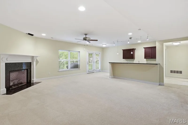 Lower-level walks out to large covered patio — 14 Burgundy Place Drive, Dardenne Prairie, MO 63368