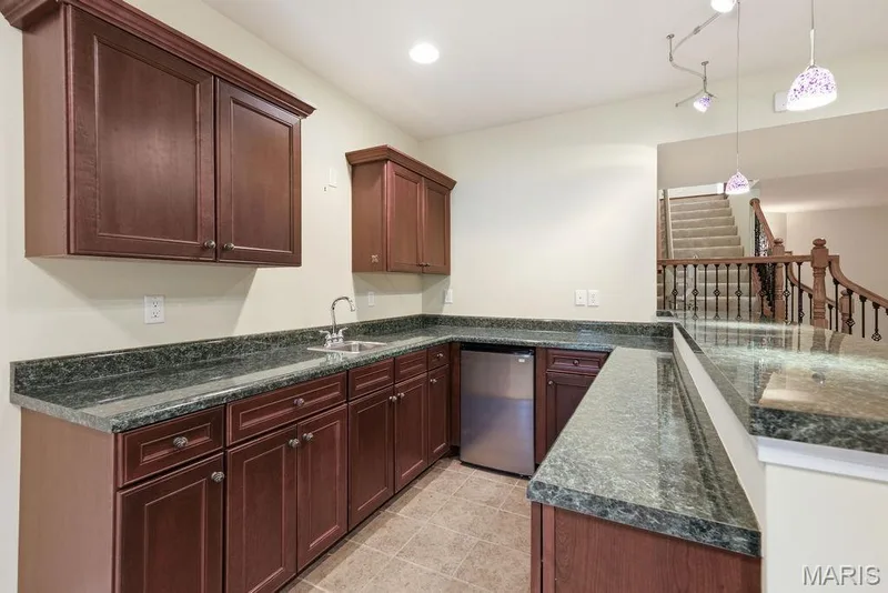 Wet bar with sink, fridge & lots of cabinets — 14 Burgundy Place Drive, Dardenne Prairie, MO 63368