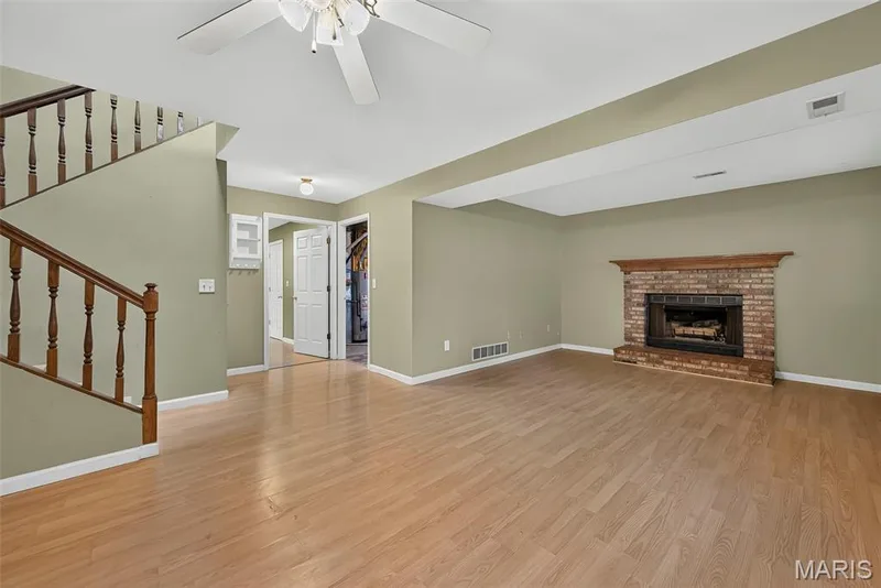 Lower Level Family Room with Wood Burning Fireplace — 1719 Foxglove Drive, St Charles, MO 63303