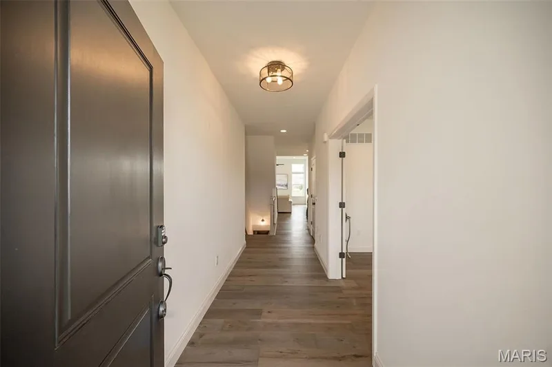 Entry Foyer with luxury vinyl plank flooring throughout the main living area — 325 Gailin Drive, Lake St. Louis, MO 63367