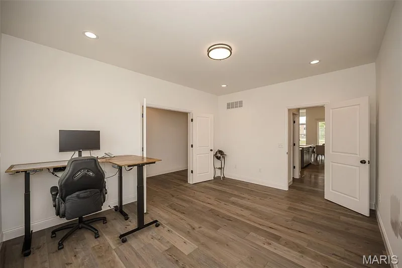 Dinning Room/Flex Room with luxury vinyl plank flooring — 325 Gailin Drive, Lake St. Louis, MO 63367