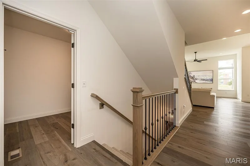 Main Floor Laundry Room is located between the garage entrance and Entry Foyer — 325 Gailin Drive, Lake St. Louis, MO 63367