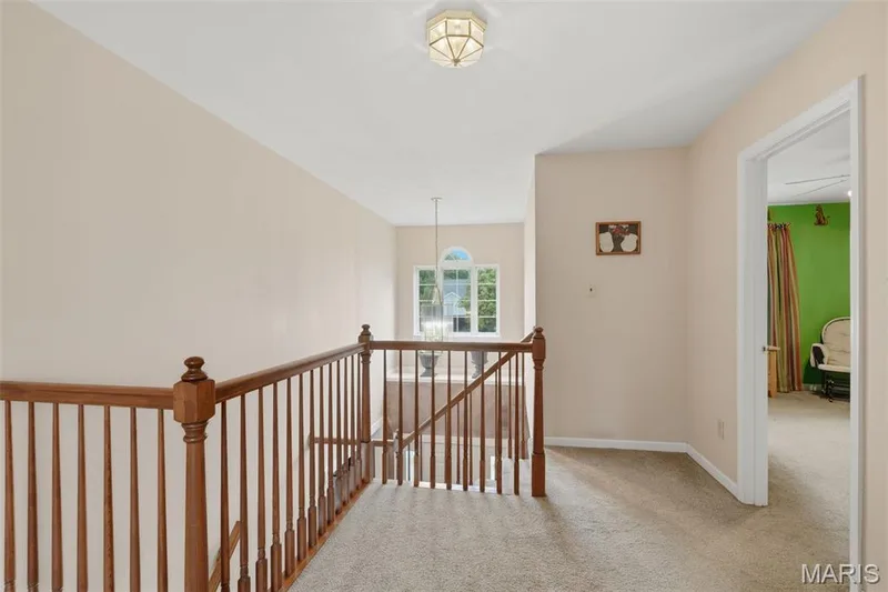 L shaped stairwell leading to upper level — 28 Seabiscuit Drive, St Charles, MO 63301