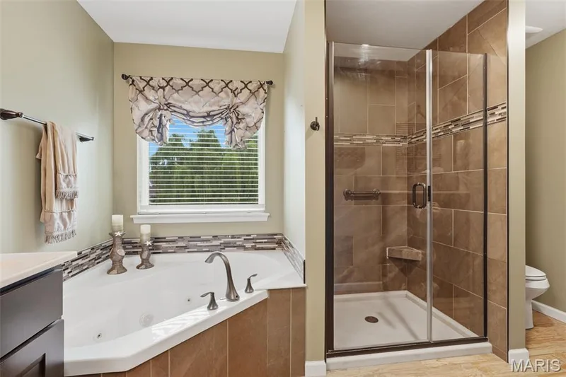 Separate tub and shower . Beautiful tile work — 28 Seabiscuit Drive, St Charles, MO 63301