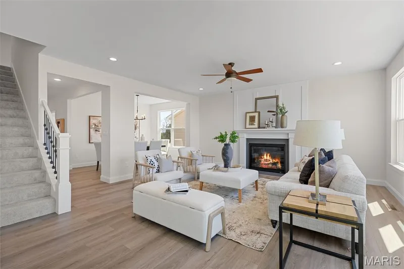 Great Room with view of fireplace and Dining room — 305 Healthy Way, St Charles, MO 63304