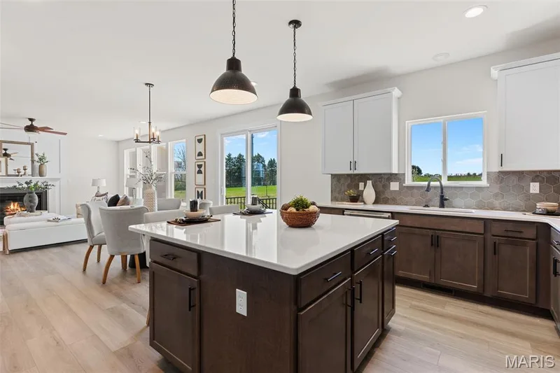 Kitchen with custom cabinets, Quartz countertops and stainless steel gas appliance — 305 Healthy Way, St Charles, MO 63304