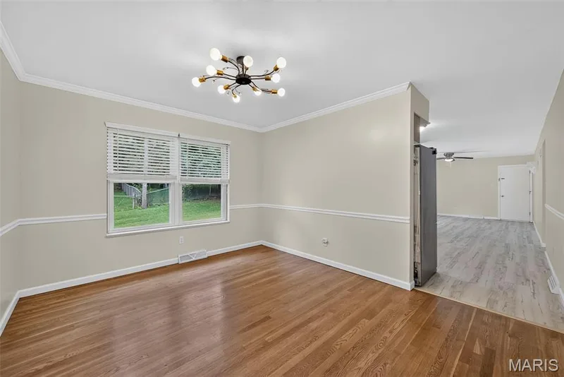 The dining room connects to the kitchen and living room. — 208 Meadowlark Lane, St Charles, MO 63301