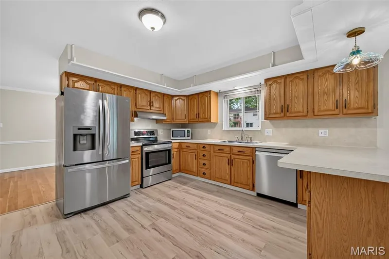 Large kitchen with stainless steel appliances — 208 Meadowlark Lane, St Charles, MO 63301