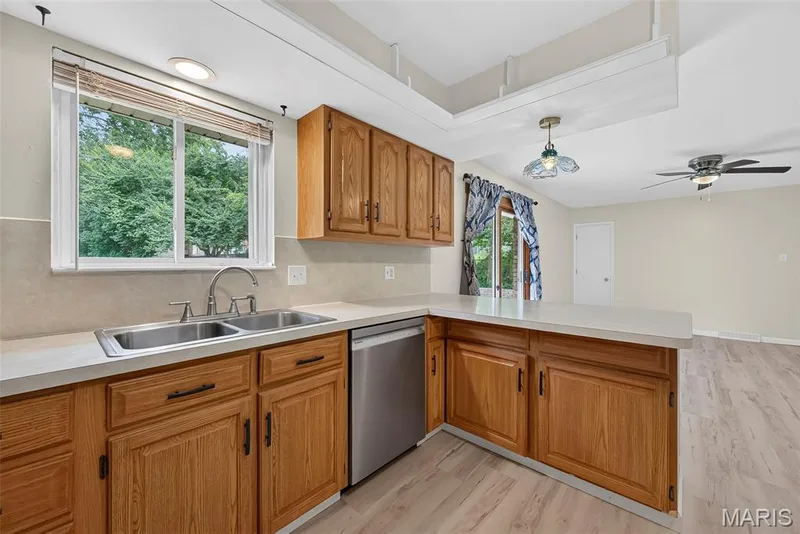 Plenty of cabinet space, prep space, and window overlooking the fenced back yard. — 208 Meadowlark Lane, St Charles, MO 63301
