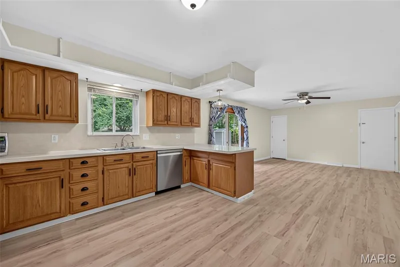 The kitchen opens to a hearth room/family room area. — 208 Meadowlark Lane, St Charles, MO 63301