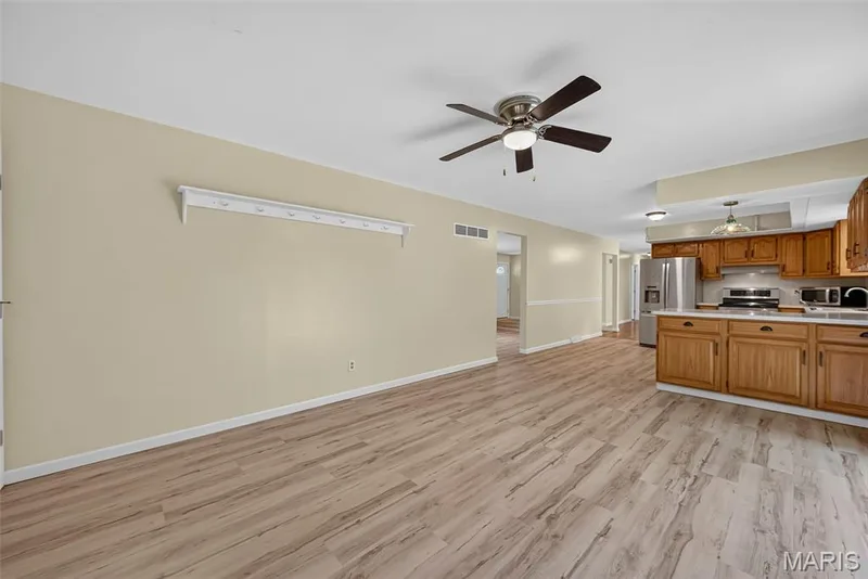 LVP flooring throughout the kitchen and hearth room — 208 Meadowlark Lane, St Charles, MO 63301