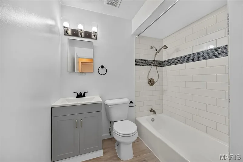 Hall bath with ceramic tile flooring — 208 Meadowlark Lane, St Charles, MO 63301