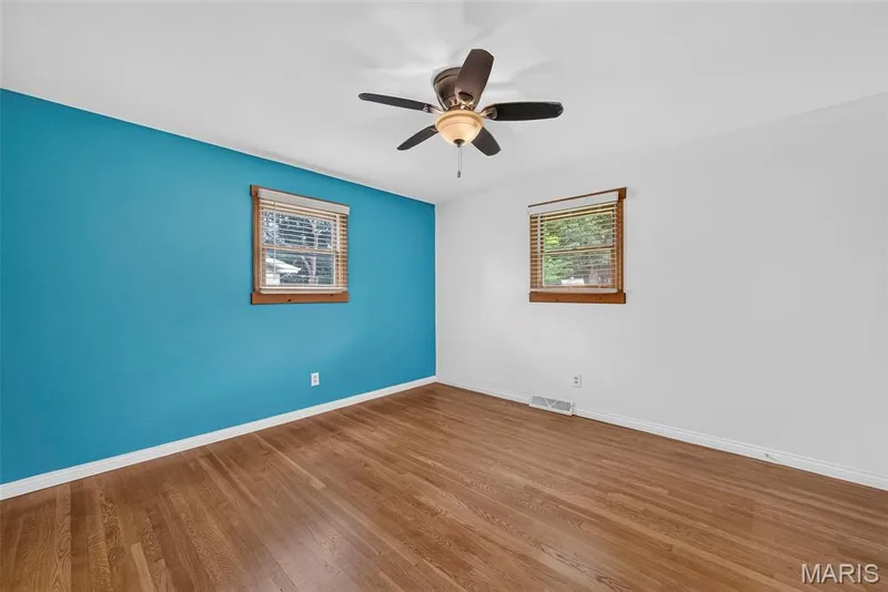 The primary bedroom with hardwood floors — 208 Meadowlark Lane, St Charles, MO 63301